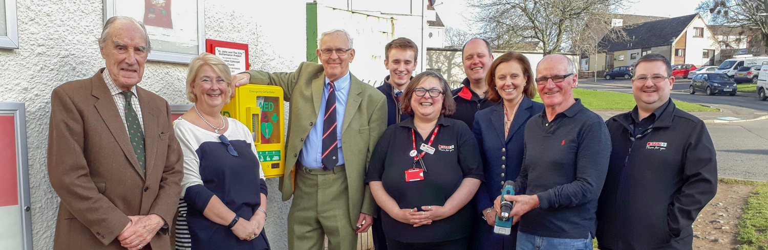 Photo of volunteers with a defibrillator in Jedburgh