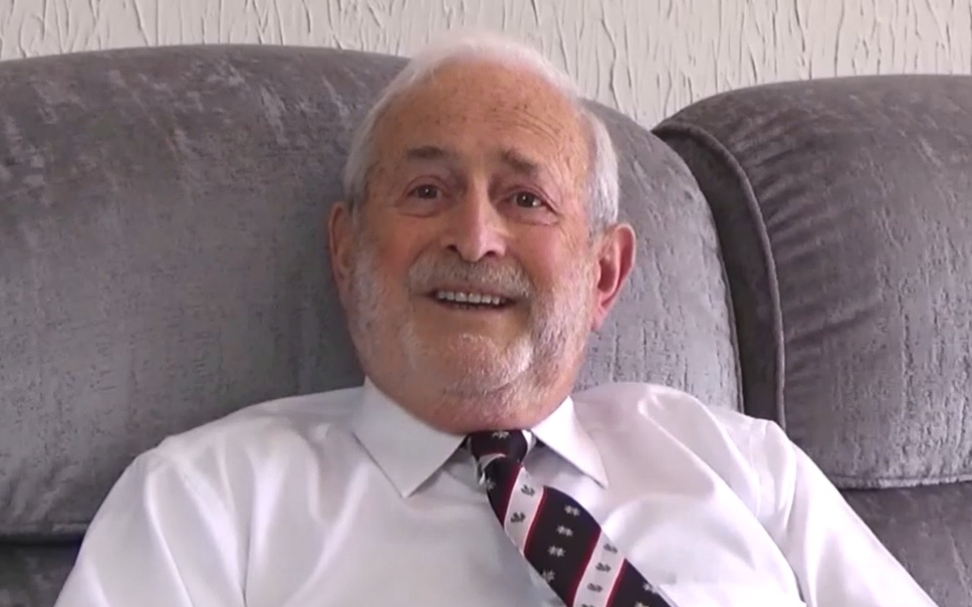 A man sitting on a sofa