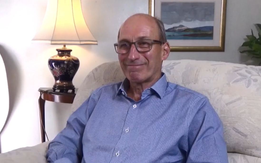 A man sitting on a sofa